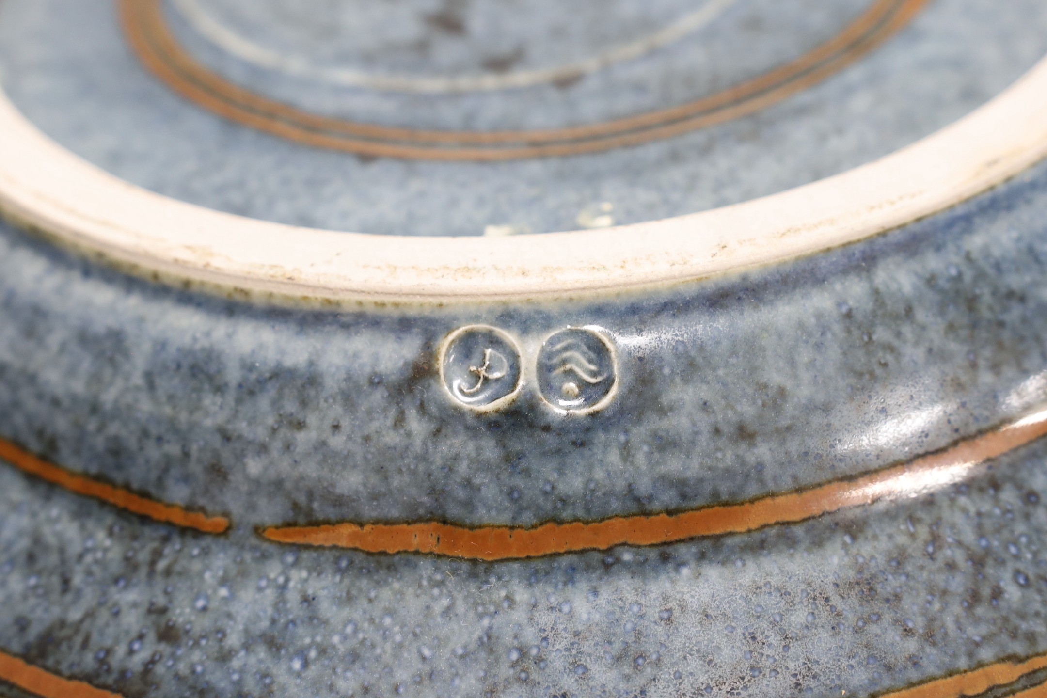 David Frith for Brookhouse Pottery - a circular stoneware charger with leaf and berry decoration. 41cm